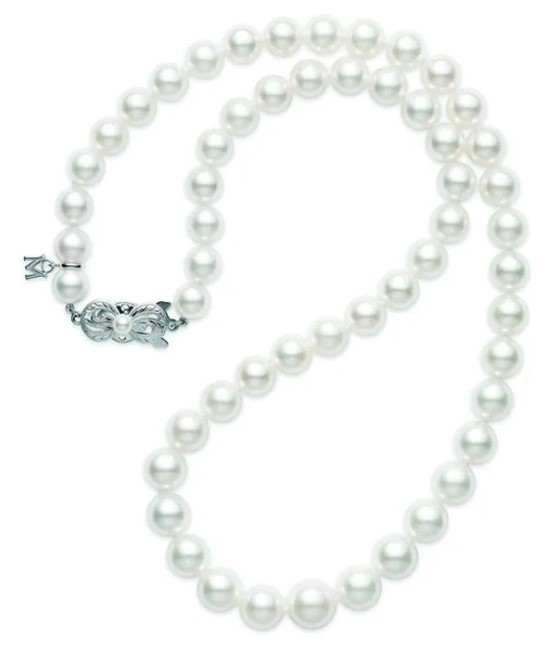 Mikimoto graduated cultured pearl necklace  18 inches long  having white pearls measuring 9 x 7mm each  A-1 quality and an 18 karat white gold signature clasp.